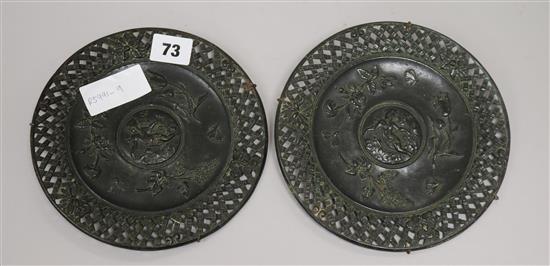 A pair of bronze circular plaques diameter 18cm